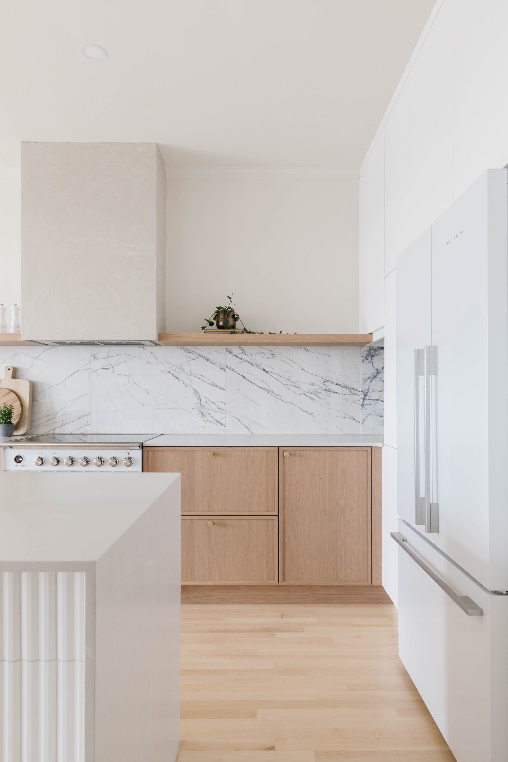 White fluted island and custom range hood, De Lorimier kitchen