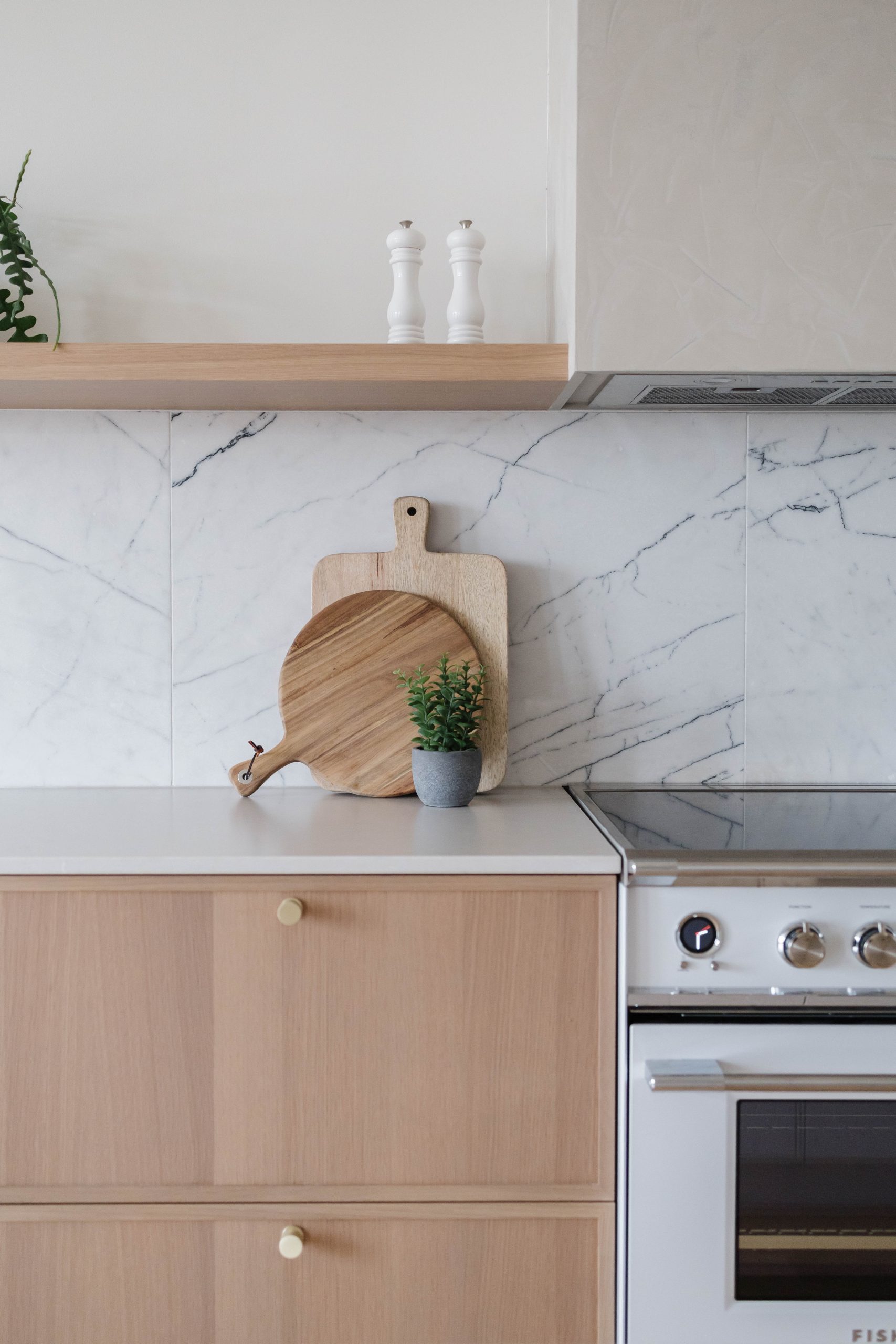 Custom light oak kitchen with white countertop and marble backsplash, De Lorimier project